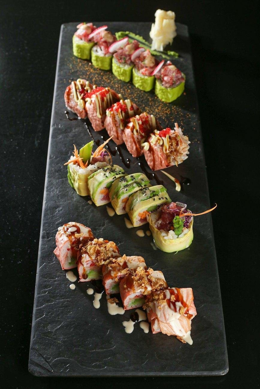 A long slate of four kinds of specialty makis