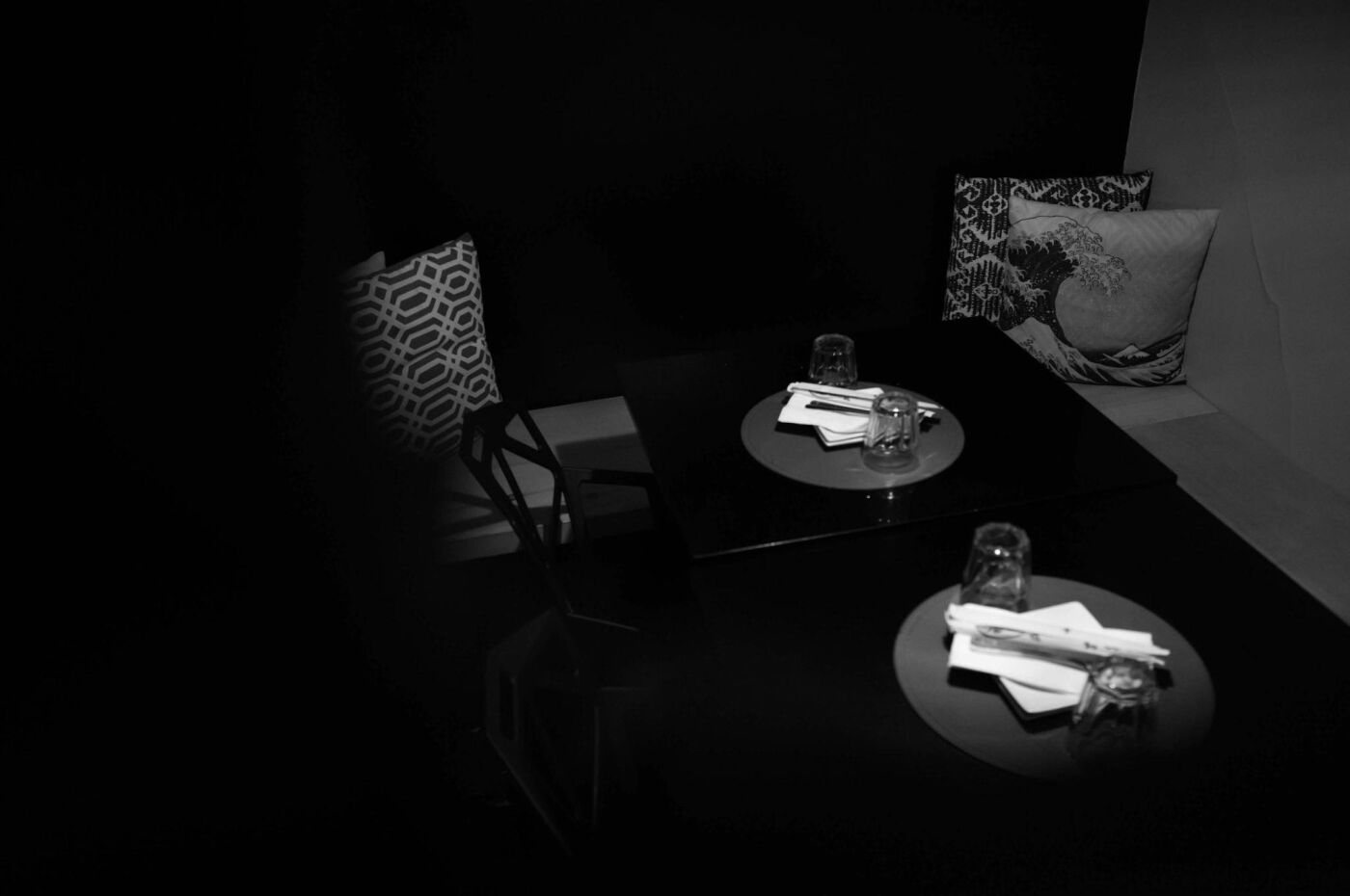 A set table in the dim dining room